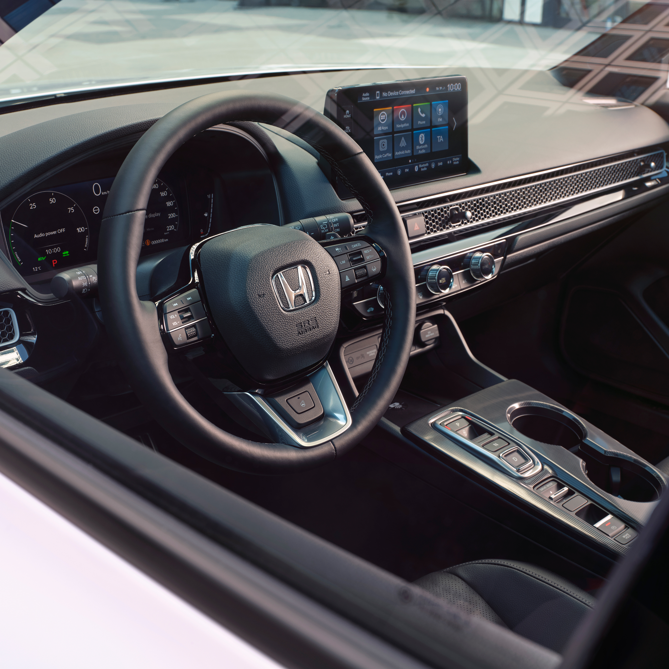 Angled view of the Honda civic hybrid' interior, focusing on the steering wheel.